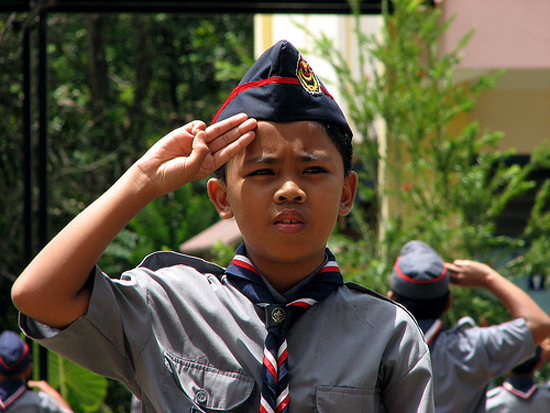 Boy Scout making the Scout salute