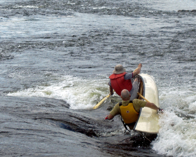Canoe capsizing with two men falling out