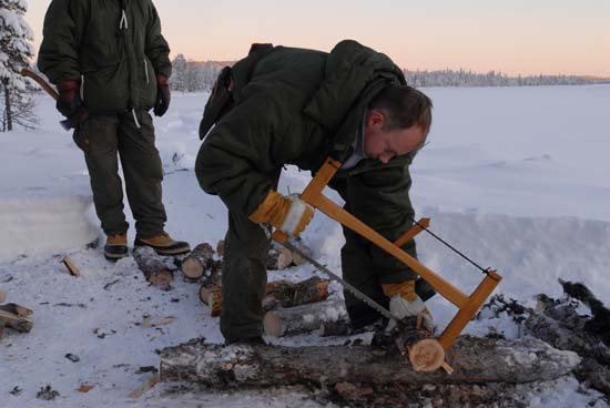 A full-sized saw makes sectioning firewood an efficient and safe job.