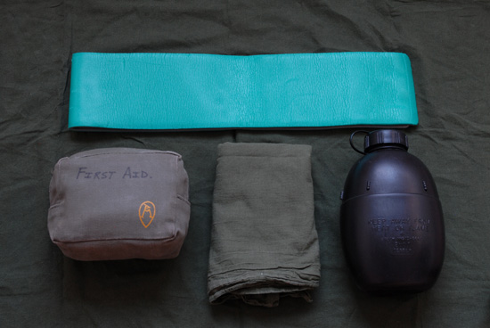Wilderness First Aid Kit packed in pouch, alongside other useful outdoor first aid items.