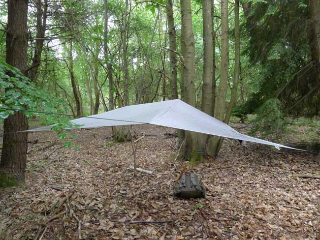 A lightweight tarp provides good ground coverage