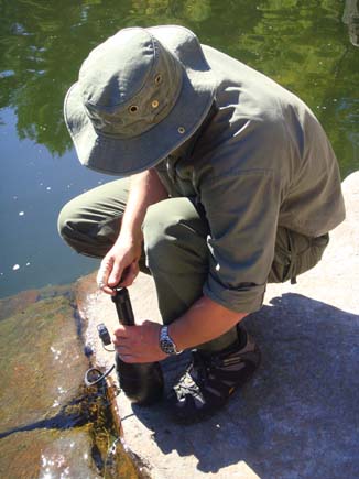 Author using water purification pump