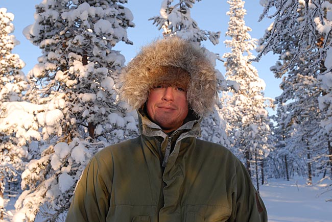 Paul Kirtley wearing warmest hat and jacket hood at thirty below in northern Sweden.
