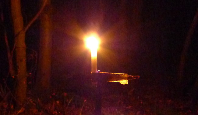 Candle burning in improvised candle holder