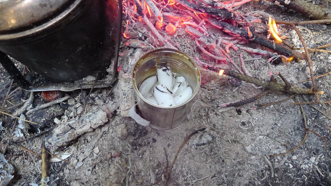 Can containing candles next to a fire