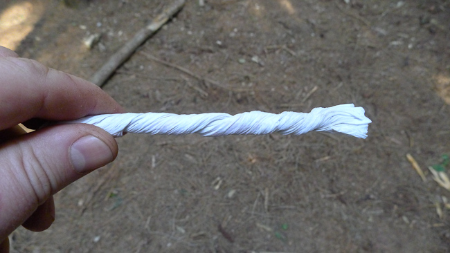 Twisted up tissue paper intended as a wick