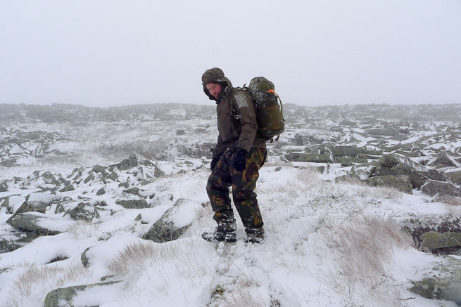Man descending snowy mountain in Sweden