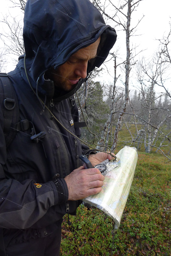 Man using map and compass