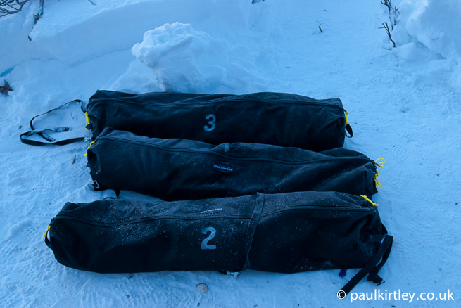 Duffel bags in snow