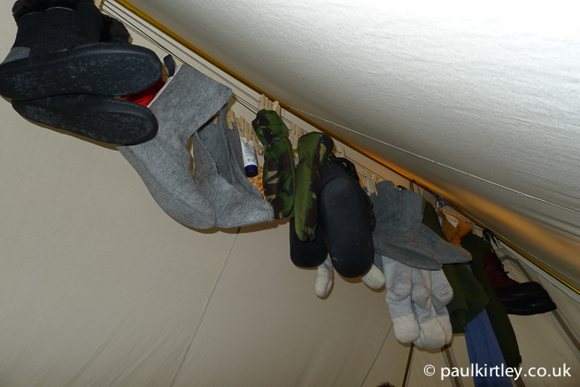Clothing hung up inside a heated tent