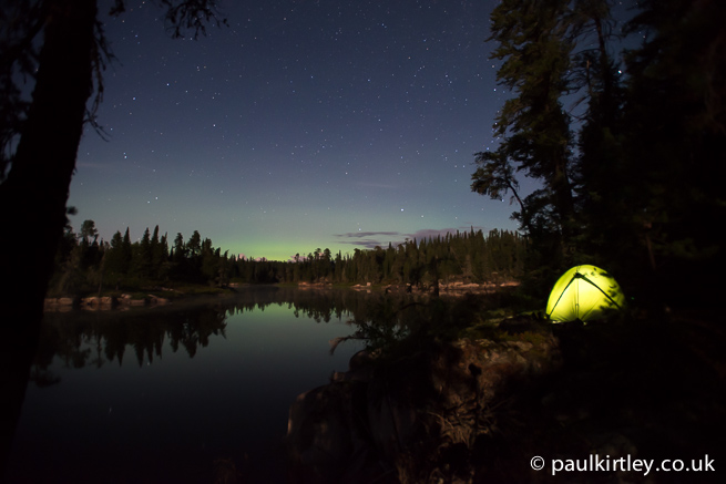 Illuminated tent with stars and aurora