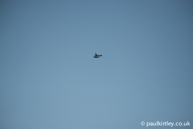 Float plane against backdrop of blue sky
