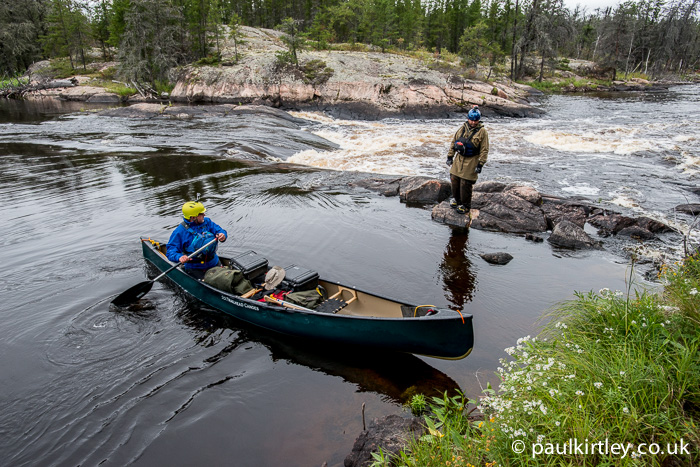Ray Goodwin paddling tandem expedition boat solo on a wilderness trip in Canada