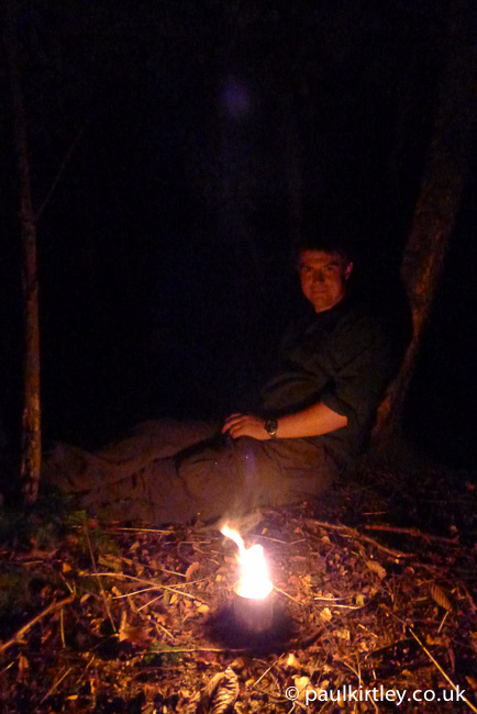 Paul Kirtley illuminated by an improvised tin-can candle
