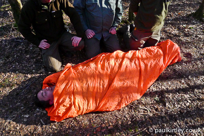 Adam Gent in bothy bag on Frontier Bushcraft staff first aid training exercise