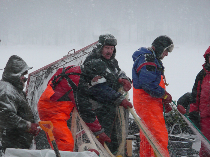 Finnish fisher men in a blizzard