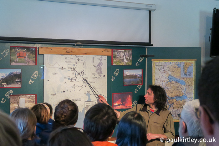Los Glaciares National Park Ranger pointing at a map during a briefing