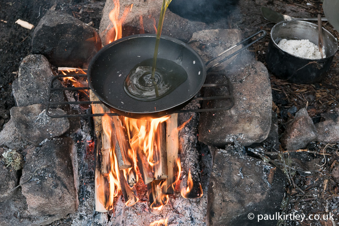 Set the pan over the fire and add some oil.  Don't get it too hot. The olive oil will add great flavour to the bread. Photo: Amanda Quaine