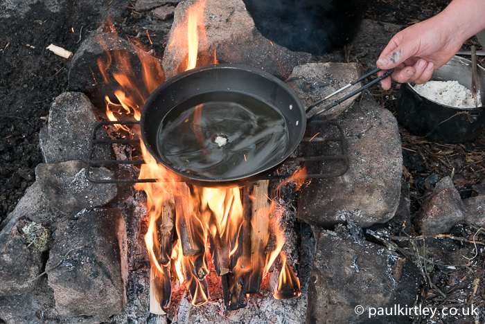 Put a little bit of dough in the oil and wait for it to start sizzling. Photo: Amanda Quaine
