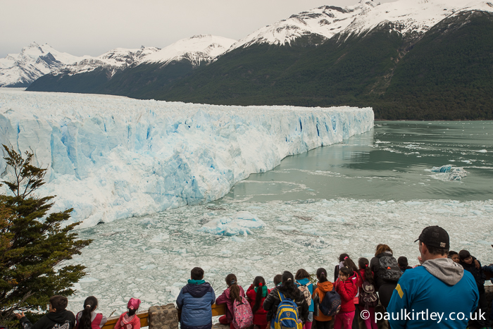 A busy viewing platform in front of the Perito Moreno glacier.