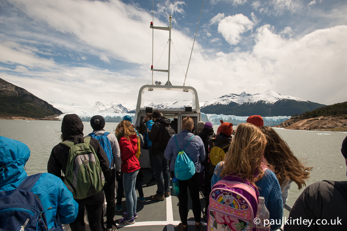 People on a boat heading towards Pareto Moreno glacier