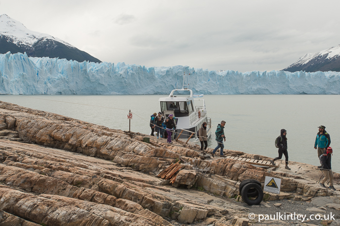 Boat moored in front of Perito Moreno glacier