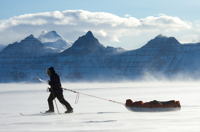 Man pulling a pulk in Greenland