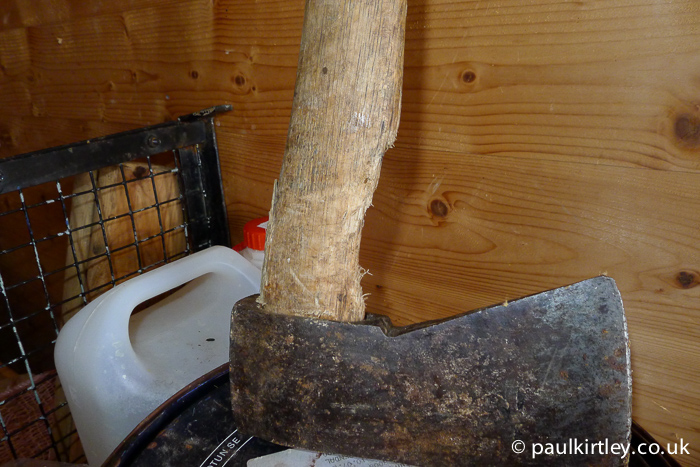 Overstrike damage on an axe in a remote cabin woodshed in Norway.