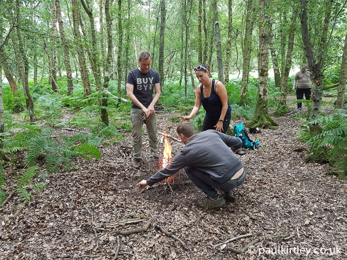 Bushcraft course students light fires