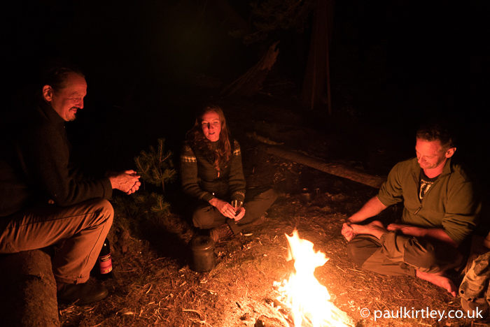 Juha Rankinen, Lisa Fenton and Iain Gair around a campfire