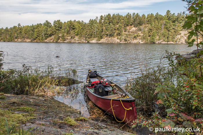 Canoe with gear in Canadian Shield country