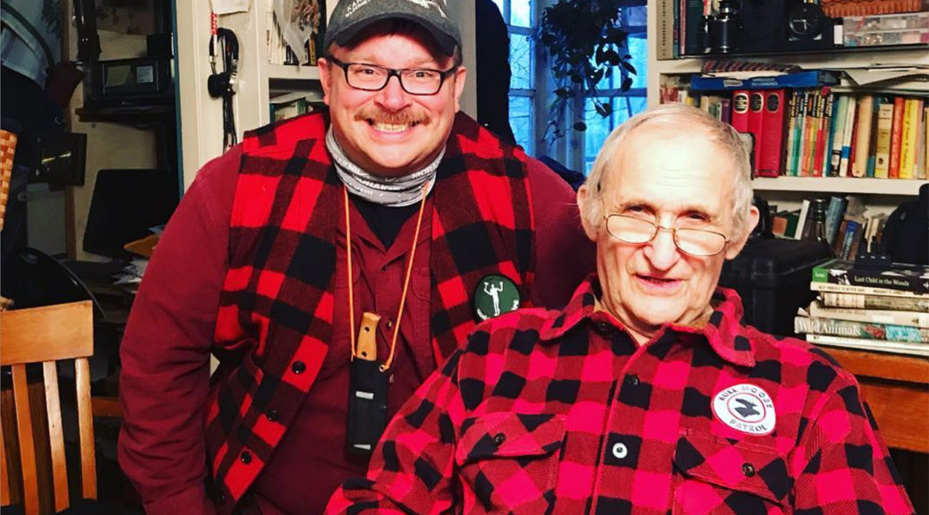 Two Canadian outdoorsmen in red check shirts