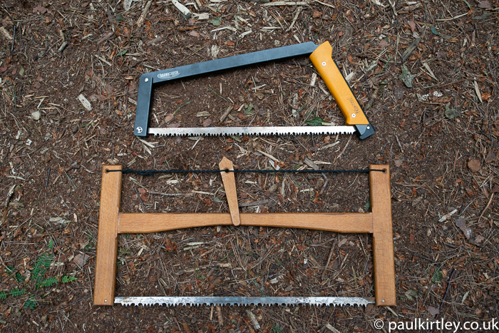 Two folding saws, one metal frame, one wooden frame