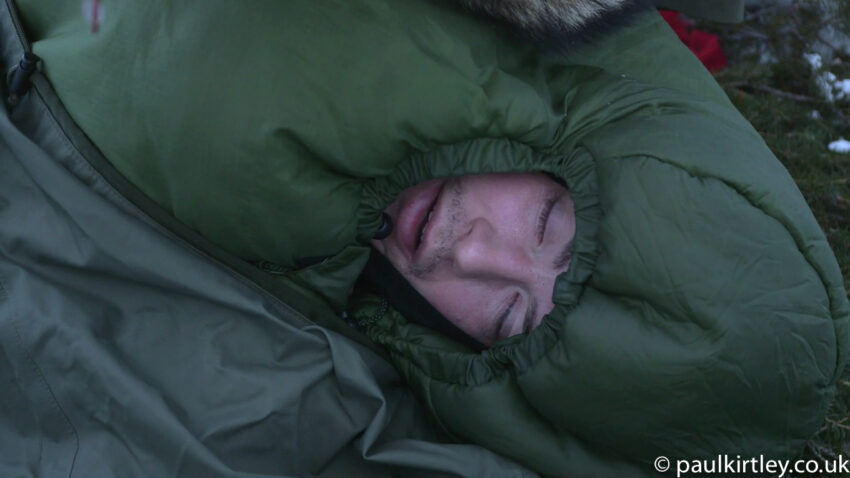 Man wrapped up in winter sleeping bag