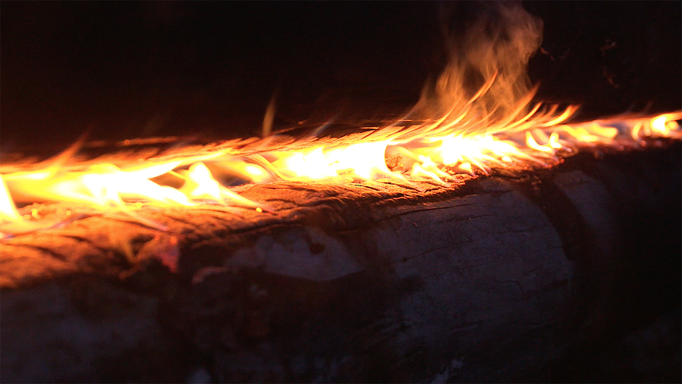 Swedish long log fire known as Nuorssjo closeup of steady flame