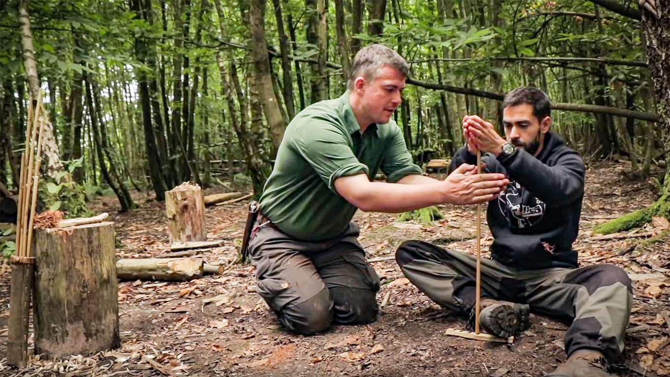 Paul Kirtley working with Mike Pullen to achieve hand drill ember