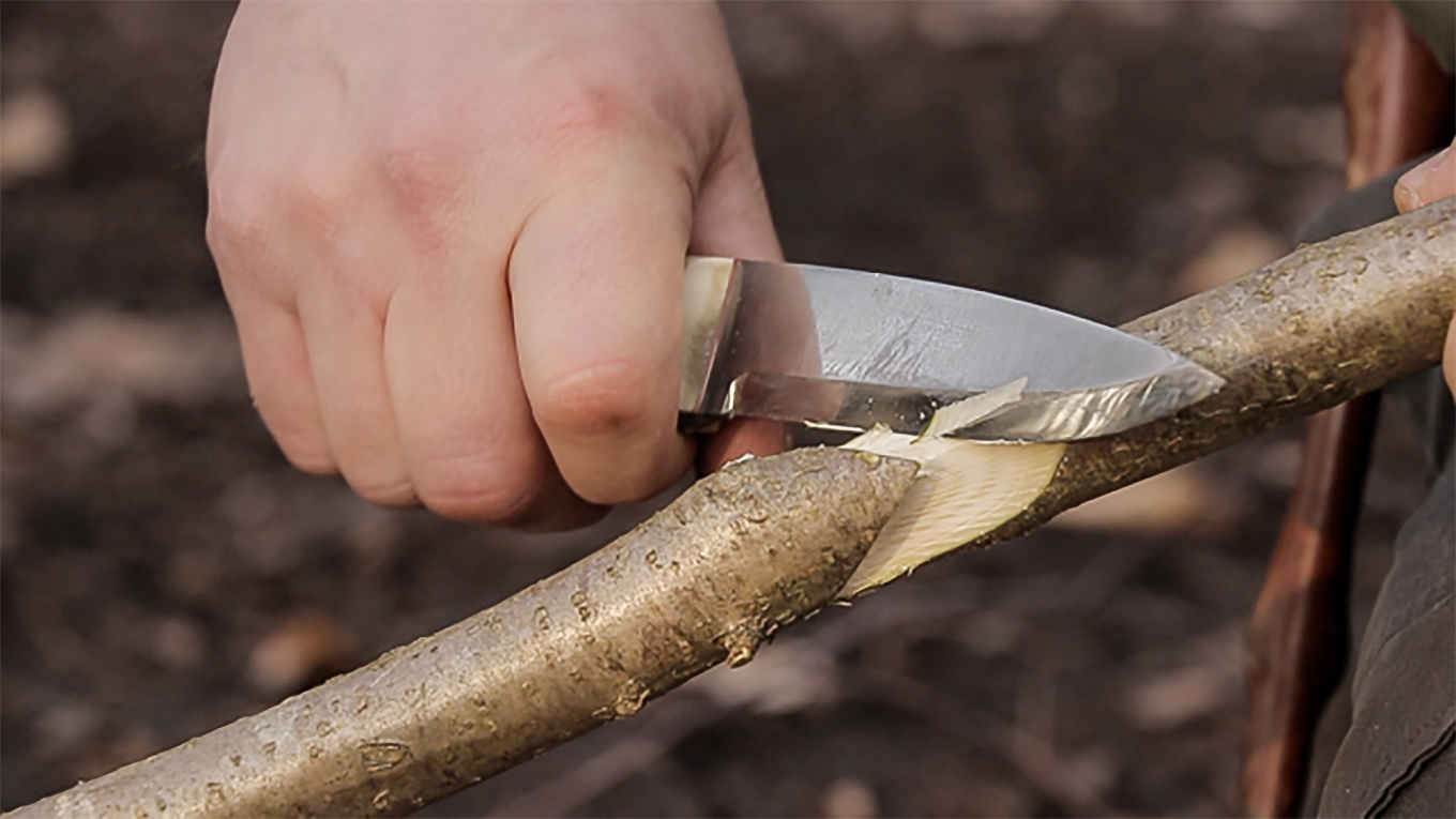 Woodlore Instructor's Knife being used for campcraft