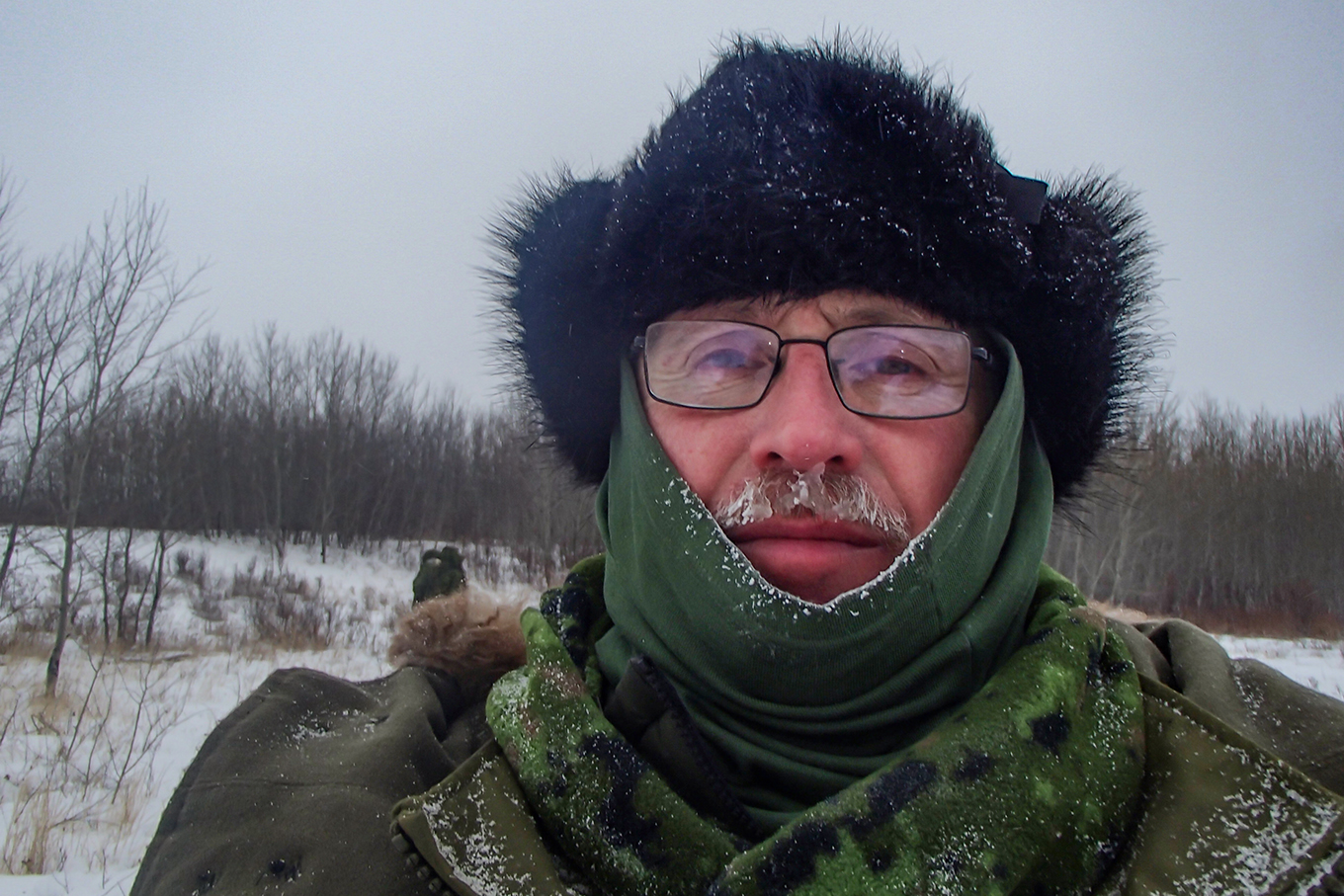 Man wearing frosty winter clothing in Canadian snow conditions.