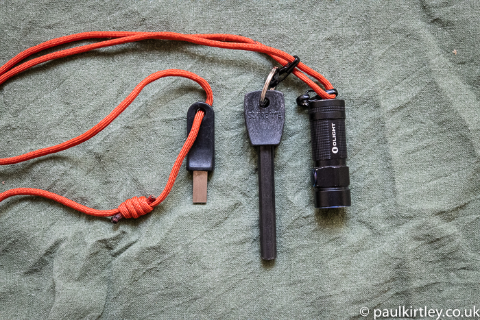 Ferro rod and small flashlight on a pocket lanyard